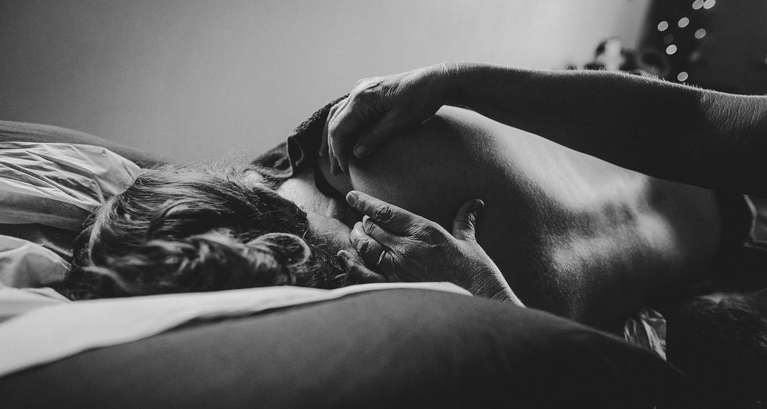 Pregnant woman being massaged on a massage table